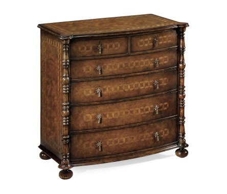 Walnut small bow front chest with circle inlays