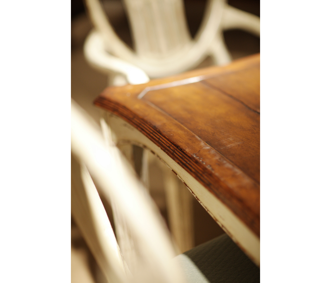 White rub-through dining table
