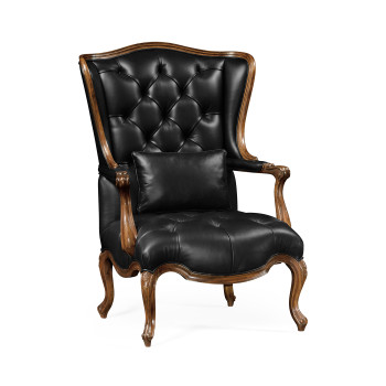 Wing-backed chair in black leather