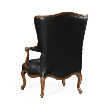 Wing-backed chair in black leather