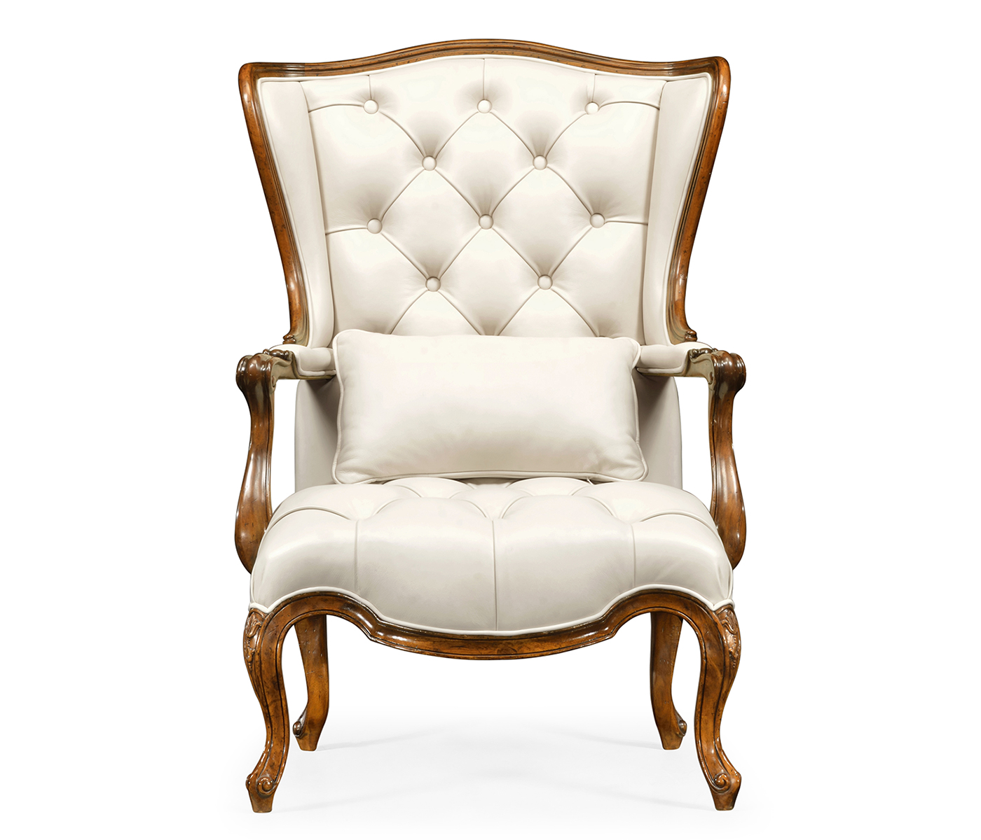 Wing-backed chair in cream leather