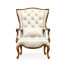 Wing-backed chair in cream leather