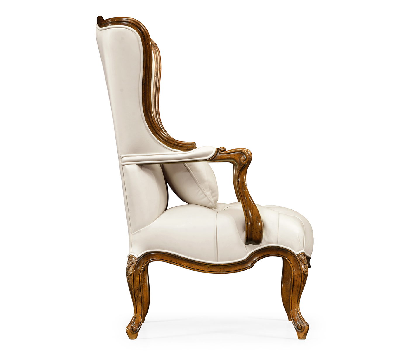 Wing-backed chair in cream leather