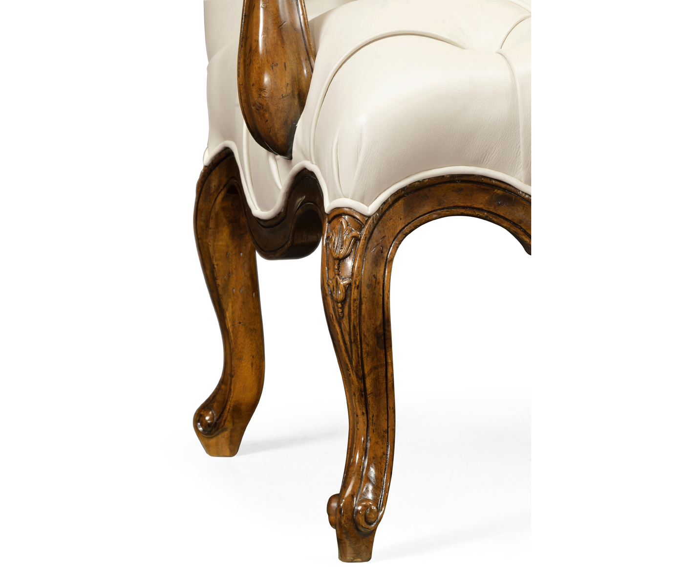 Wing-backed chair in cream leather