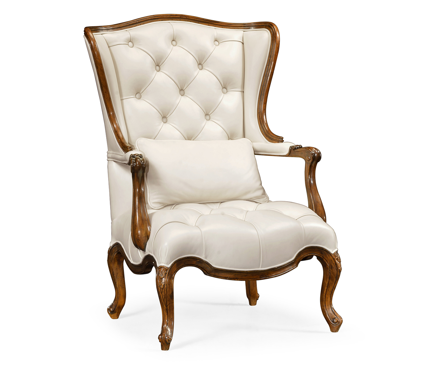 Wing-backed chair in cream leather