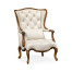Wing-backed chair in cream leather