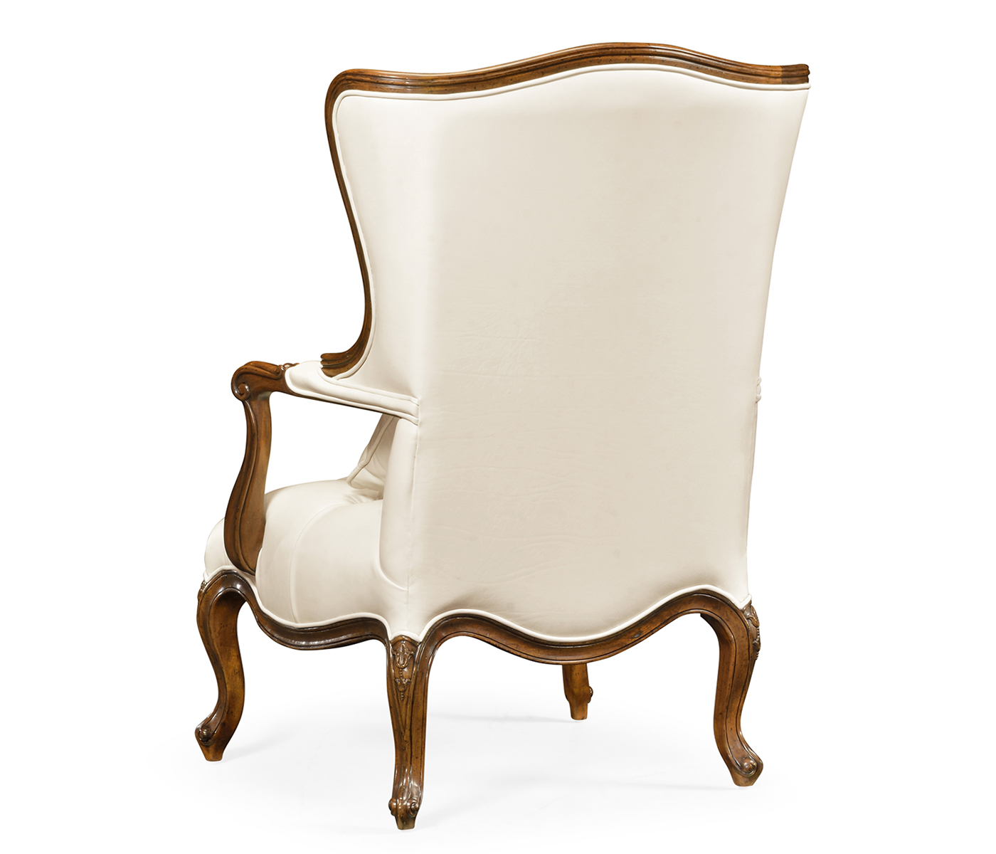 Wing-backed chair in cream leather