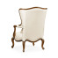 Wing-backed chair in cream leather